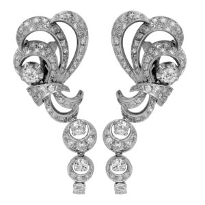 Antique 18k white gold ribbon drop earrings set with 4.80 carats of old European cut and single cut diamonds.