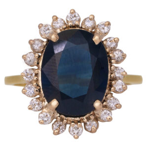Vintage 14k white gold halo ring centered with a 3.85 carat oval earth-mined blue sapphire surrounded by 0.30 carats of round brilliant earth-mined diamonds.