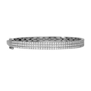 Vintage 18k white gold three-row bangle bracelet set with 3.30 carats of round brilliant earth-mined diamonds.