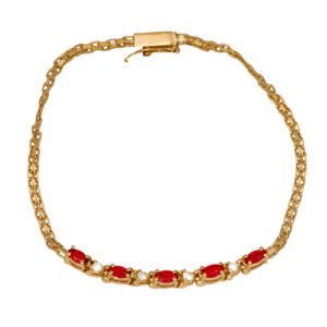 Vintage 14k yellow gold bracelet set with 0.50 carats marquise rubies plus 0.08 carats round brilliant earth-mined diamonds.