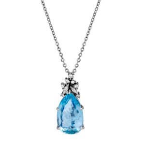 Vintage 18k white gold pendant set with an 8.24 carat pear cut aquamarine plus 0.20 carats of round brilliant and marquise earth-mined diamonds on a 18" cable chain.