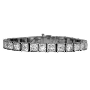 Vintage 18k white gold tennis bracelet set with 28.72 carats of princess cut earth-mined diamonds.