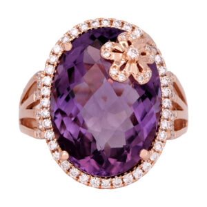 Vintage 18k rose gold halo flower ring set with a 12.57 carat oval checkerboard amethyst and 0.45 carats of round brilliant earth-mined diamonds.