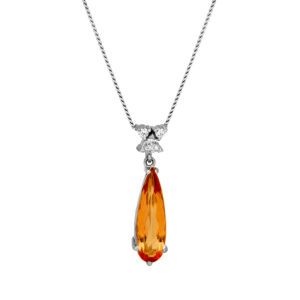 Vintage 18k white gold pendant set with a 2.41 carat pear cut Imperial topaz plus 0.10 carats of round brilliant earth-mined diamonds on a 20" cable chain.