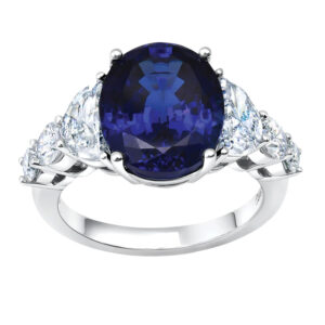 New 18k white gold Chatham ring set with a 6.75 carat oval cut lab-grown sapphire plus 1.64 carats of half moon cut and round brilliant lab-grown diamonds.