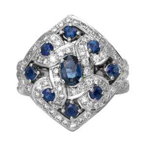 Vintage 18k white gold kite ring set with 1.10 carats of oval and round brilliant blue sapphires plus 0.93 carats of round brilliant diamonds.