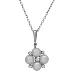 Vintage 18k white gold Mikimoto pendant set with a pearls plus 0.38 carats of round brilliant earth-mined diamonds.