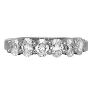 Vintage platinum band set with 1.25 carats of oval earth-mined diamonds.