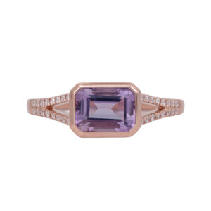 Vintage 14k rose gold split shank ring set with a 1.27 carat emerald cut lavender amethyst and 0.16 carats of round brilliant earth-mined diamonds.