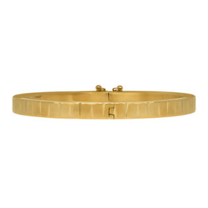 Vintage 14k yellow gold notched bangle with safety chain.
