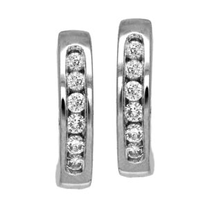 Vintage 18k white gold huggie hoop earrings set with 0.12 carats of round brilliant earth-mined diamonds.