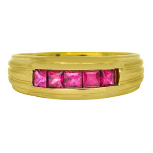 Vintage 18k yellow gold grooved band set with 0.86 carats of princess rubies.