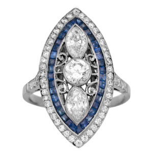 Antique platinum ring set with a 0.50 carat old European cut earth-mined diamond plus 0.77 carats of marquise earth-mined diamonds plus 0.82 carats of princess blue sapphires plus 0.54 carats of round brilliant earth-mined diamonds.