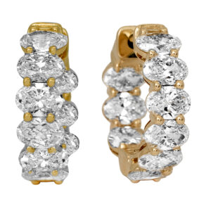 New 14k yellow gold huggie hoop earrings set with 3.66 carats of oval lab-grown diamonds.