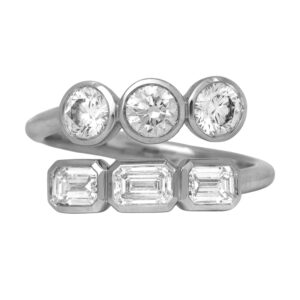 New 14k white gold bypass ring set with 0.88 carats of emerald cut lab-grown diamonds plus 0.88 carats of round brilliant lab-grown diamonds.