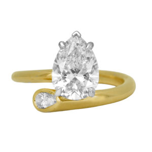 New 14k yellow gold Toi et Moi bypass ring set with a 2.32 carat pear lab-grown diamond plus a 0.16 carat pear lab-grown diamond.
