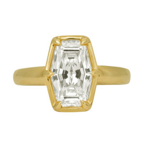 New 14k yellow gold solitaire engagement ring set with a 3.10 carat hexagon lab-grown diamond.