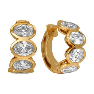New 14k yellow gold huggie hoop earrings set with 3.66 carats of lab-grown oval diamonds.