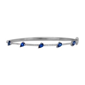 New 18k white gold bangle set with 1.34 carats of pear sapphires and 0.29 carats of round brilliant earth-mined diamonds.