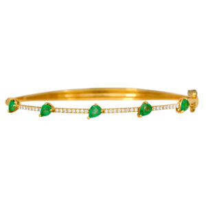 New 18k yellow gold bangle set with 0.98 carats of pear emeralds and 0.28 carats of round brilliant earth-mined diamonds.