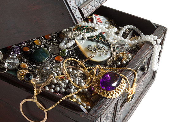 a chest full of various pieces of vintage and estate jewelry.