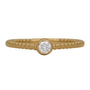 New 14k yellow gold braided solitaire engagement ring set with a 0.11 carat round brilliant earth-mined diamond.