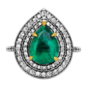 New 18k white & yellow gold ring set with a 2.62 carat pear Zambian emerald plus 0.60 carats of round brilliant earth-mined diamonds in a double halo setting.