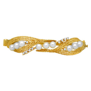 Vintage 14k yellow gold bangle set with pearls plus 0.25 carats of single cut earth-mined diamonds.