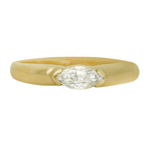 Vintage 14k yellow gold east-west solitaire engagement ring set with a 0.47 carat marquise lab-grown diamond. In an “east-west” setting, the center diamond is set horizontally across the finger rather than the traditional “north-south” orientation. Especially effective for elongated shapes such as oval, marquise, and emerald cuts.