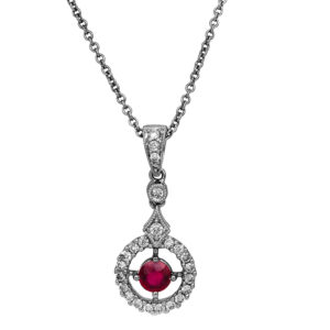 New 18k white gold halo pendant set with a 0.35 carat round brilliant ruby plus 0.28 carats of round brilliant earth-mined diamonds on a 16" cable chain.