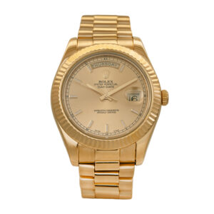 Pre-owned Rolex Day-Date watch, 41mm in 18k yellow gold with a champagne dial, fluted bezel, President bracelet, and automatic movement, with box & card.