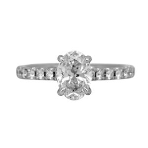 Vintage 18k white gold engagement ring set with a 1.52 carat oval earth-mined diamond plus 0.70 carats of round brilliant earth-mined diamonds.