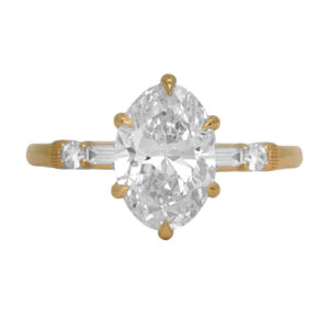 New 14k yellow gold under halo engagement ring set with a 3.04 carat lab-grown oval diamond plus 0.31 carats of lab-grown round brilliant and baguette diamonds.