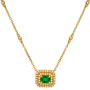 New 18k yellow gold halo necklace set with a 0.58 carat emerald cut emerald plus 0.27 carats of round brilliant earth-mined diamonds on a 16-18" chain.
