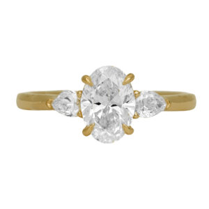 New 14k yellow gold three stone engagement ring set with a 1.50 carat lab-grown oval diamond plus 0.36 carats of lab-grown pear diamonds.