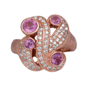 Vintage 14k rose gold milgrain free form ring set with 0.75 carats of round brilliant pink sapphires plus 1.00 carat of round brilliant earth-mined diamonds.