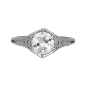 Antique platinum solitaire engagement ring set with a 1.10 carat old European cut earth-mined diamond.