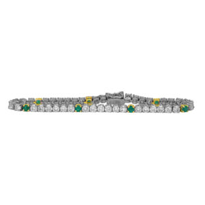 Vintage 18k white and yellow gold tennis bracelet set with 6.00 carats of round brilliant earth-mined diamonds plus 1.05 carats of round brilliant emeralds.