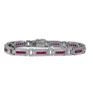 Vintage 18k white gold bracelet set with 5.50 carats of princess rubies plus 2.20 carats of round brilliant earth-mined diamonds.