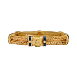 Vintage 18k yellow gold woven two row bracelet set with 0.28 carats of round brilliant earth-mined diamonds and blue enamel.