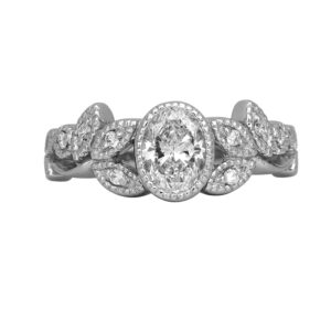 Vintage platinum floral ring set with a 0.71 carat oval earth-mined diamond plus 0.08 carats of round brilliant earth-mined diamonds.