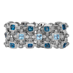 Vintage sterling silver David Yurman three row bracelet set with cushion blue topaz.
