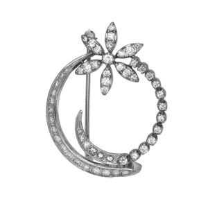 Vintage 14k white gold flower circle brooch set with 1.46 carats of round brilliant earth-mined diamonds.