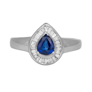 Vintage 18k white gold halo ring set with a 0.55 carat pear sapphire plus 0.52 carats of baguette earth-mined diamonds.