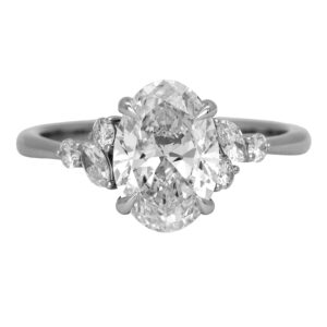 New 14k white gold engagement ring set with a 2.00 carat lab-grown oval diamond plus 0.44 carats of lab-grown round brilliant and marquise diamonds.