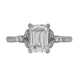 New 14k white gold under halo engagement ring set with a 2.00 carat lab-grown emerald cut diamond plus 0.30 carats of lab-grown round brilliant diamonds.