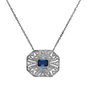 New 14k white gold pendant set with a 0.64 carat emerald cut sapphire plus 0.16 carats of round brilliant earth-mined diamonds on a 16" cable chain.