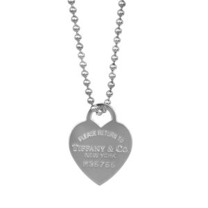 Vintage sterling silver Tiffany & Co. Please Return to Tiffany heart tag pendant on a 35" beaded necklace.