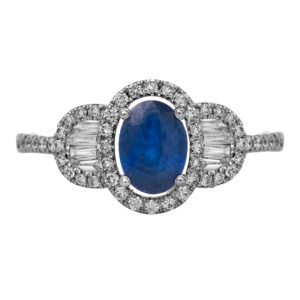 New 14k white gold halo ring set with a 1.10 carat oval blue sapphire plus 0.43 carats of round brilliant and baguette earth-mined diamonds.