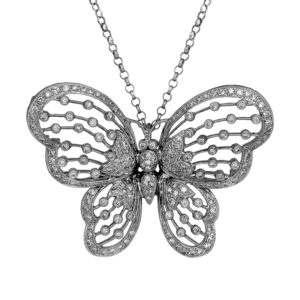 Vintage 18k white gold butterfly pendant set with 0.54 carats of round brilliant earth-mined diamonds on an 18" rolo link chain.
